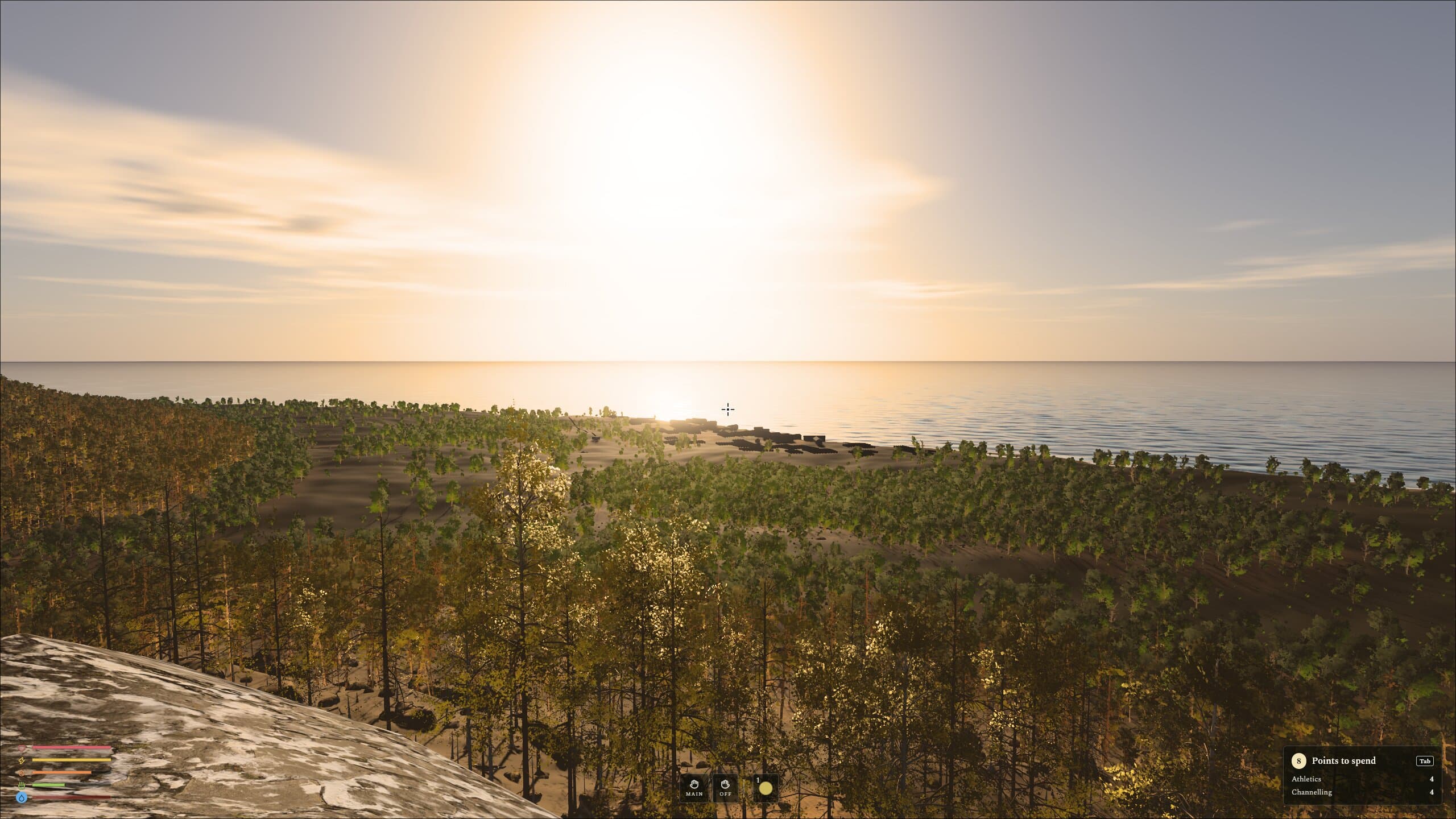 A pale sun low over the sea, lighting a forested hillside in soft gold haze